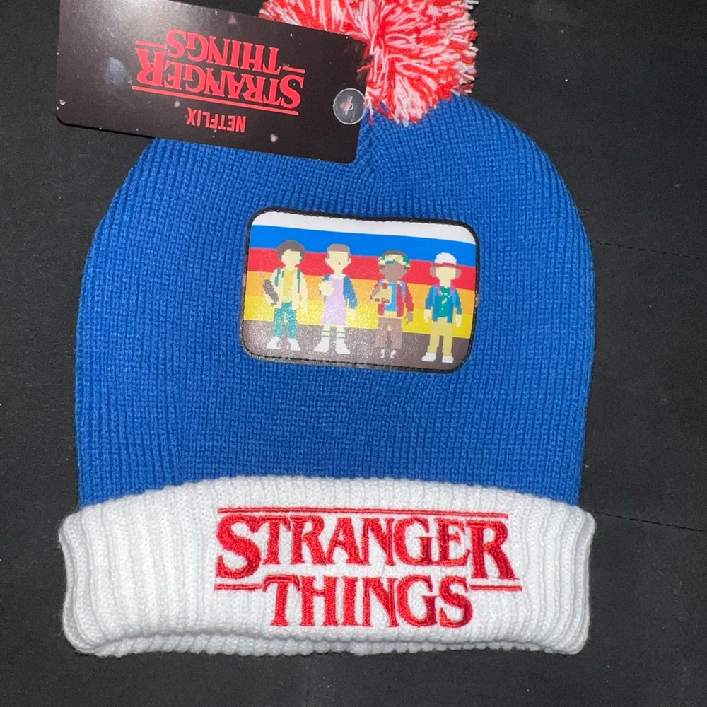 STRANGER THINGS POM KNIT HAT. BRAND NEW. ONE SIZE FITS ALL